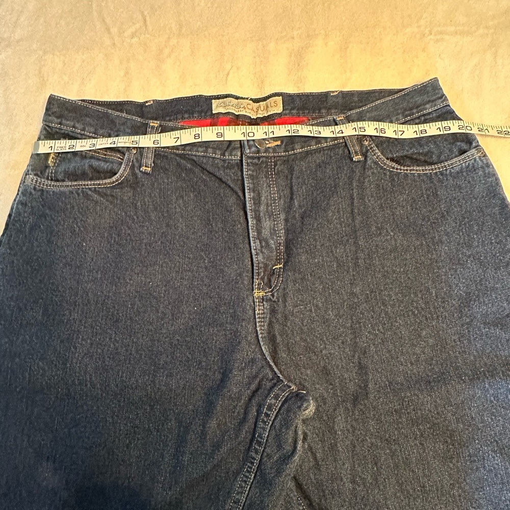Women’s Plus Cabela’s flannel lined, dark wash jeans.